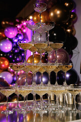 Fototapeta na wymiar Glasses slide with champagne on Holiday, Birthday, party in restaurant