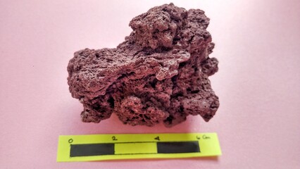 pecimen Scoria igneous rock, brownish red color from the Rinjani volcano, Indonesia. Basaltic lava,...