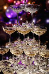 Glasses slide with champagne on Holiday, Birthday, party in restaurant