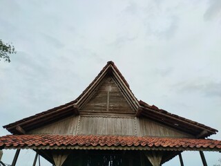 Wooden attic in Southeast Asia. Against a clear sky backdrop