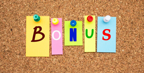 Color notes with letters pinned on a board. Word BONUS.