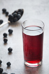 A glass full of blueberry juice