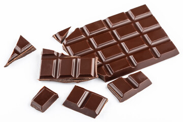 Pieces of dark chocolate on white background. Confectionery chocolate.