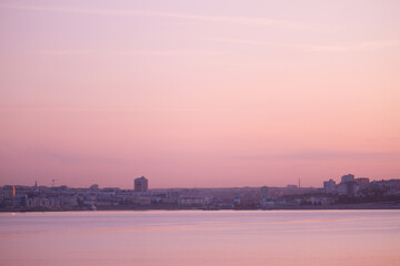 Fototapeta premium Sunset over a distant city