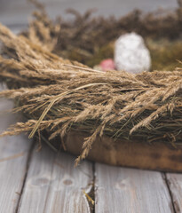 flower nest with eggs ,Easter decoration on wooden white table 