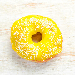 Yellow sweet donut. Sweets. Top view.