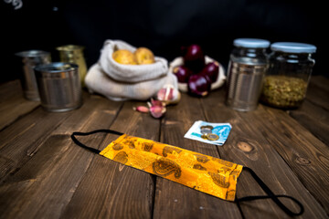 money on the table with mask and food