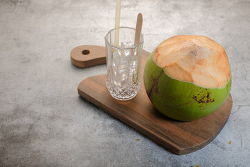 Fresh coconut fruit ready to serve as beverage. Young coconut fruit cut open to drink sweet juice and eat.