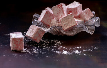 Turkish delight with rose flavor on a black background
