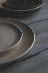 black and white plates and bowls on a wooden background