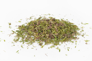 Dried and crushed thyme grass on a white background.