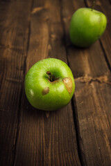 apples on brown wood table