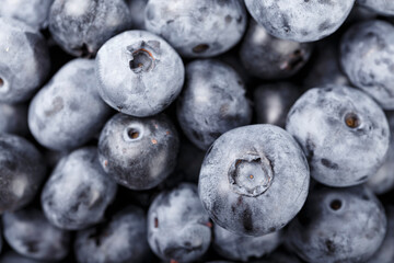 Fresh blueberry background. Blueberry texture close up. Healthy and dietary food concept.