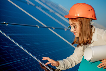 Businesswomen working on checking equipment at solar power plant with tablet checklist, woman...