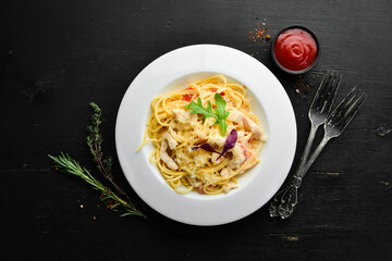Pasta with chicken meat and cheese. Italian cuisine. Top view. Free space for your text.