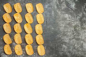 Snack party for friends with delicious potato chips on the right side of the gray background