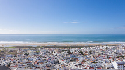 Aerial views of white town in the province of Cadiz, Andalusia. Conil de la frontera seen from above, in south Spain © Avril