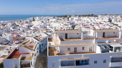 Aerial views of white town in the province of Cadiz, Andalusia. Conil de la frontera seen from above, in south Spain