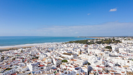 Aerial views of white town in the province of Cadiz, Andalusia. Conil de la frontera seen from above, in south Spain © Avril