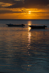 Sunset over the Indian Ocean near Le Morne on the west coast of Mauritius, Africa.
