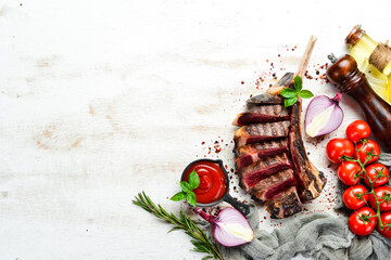 Grilled sliced beef steak with rosemary and spices. Top view. Free space for your text.
