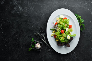 Salad of vegetables, blood sausage and mushrooms on a plate. Top view. free space for your text. Rustic style.