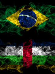 Brazil, Brazilian vs Central African Republic smoky mystic flags placed side by side. Thick colored silky abstract smoke flags.