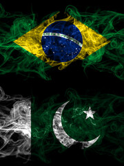 Brazil, Brazilian vs Pakistan, Pakistani smoky mystic flags placed side by side. Thick colored silky abstract smoke flags.