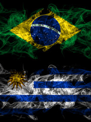 Brazil, Brazilian vs Uruguay, Uruguayan smoky mystic flags placed side by side. Thick colored silky abstract smoke flags.