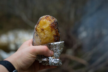 Potato cooked in the campfire.