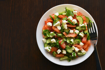 Cucumber and tomato salad with feta cheese. Greek style salad. Healthy and dietary food. Weight loss program meal.