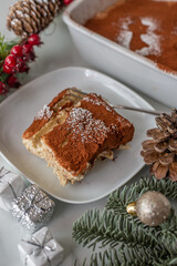 Fototapeta na wymiar sweet home made christmas tiramisu on a festive table