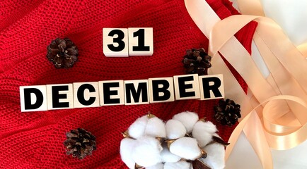 December 31 on wooden cubes .Next to the cones, cotton and tape.Winter.Calendar for December.