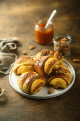 Homemade pumpkin buns with almond and jam
