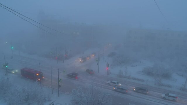 Traffic time lapse in Yakutsk in winter and break of foggy day