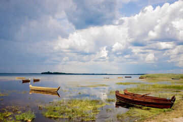 Fototapeta premium Fishing boat on the shore on lake