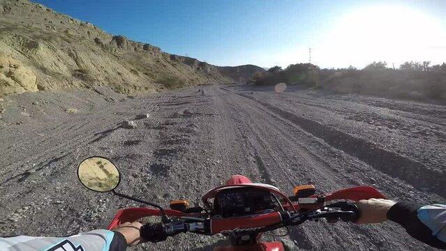 POV Enduro motocross MX rider in dirt mountain offroad track.