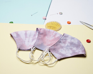 DIY project for handicraft health mask, made of cotton cloth with tie dye. Medical masks made of cloth and sewing kits. Tie-dye mask with an attractive color. The pink tie-dye mask is ready to use.