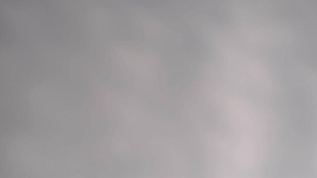 Blurry dark shadows moving on the wall. Spooky shadow art noise texture. closeup the motion of shadow batten of lath light on white wall texture background. Slow motion video. stock footage