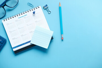 new year goals concept with 2021 calendar on color background 