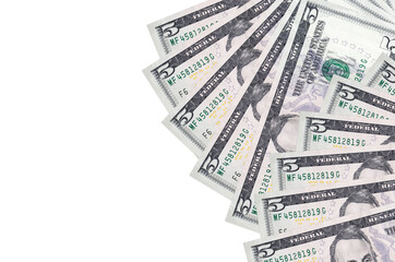 5 US dollars bills lies isolated on white background with copy space. Rich life conceptual...