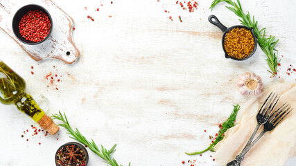 Kitchen banner with board, spices and herbs. Top view. Free space for text.