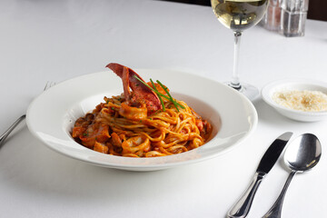 Linguine in tomato sauce with lobster and mixed seafood