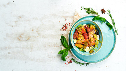 Salad with Bavarian sausages and veal. Top view. Rustic style.