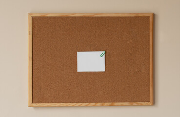 cork board with white blank paper wooden frame. notes green paperclips . reminder. pin board. isolated. new year's resolution, goals. 2021, to do list, home office, copy space. 