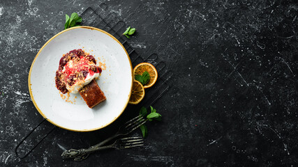 A piece of cake with fruit and cream. Top view. Free space for text.