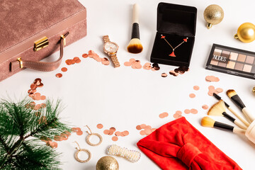 Christmas or new year eve background. Jewelry and makeup presents with neklace, makeup brush, earrings.
