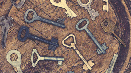 Old key on a wooden background, vintage