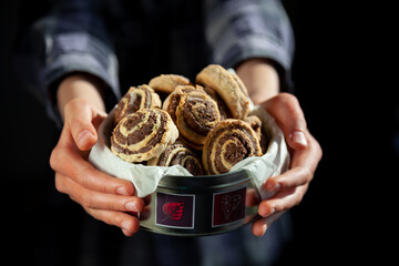 Homemade cookies in a can. Chocolate baking. Appetizing, simple food. Flour product. Buns and rolls. Home chocolate chip cookies in hands.