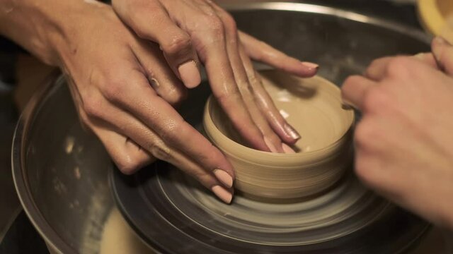 The process of preparing tableware from natural clay on a potter's machine   
